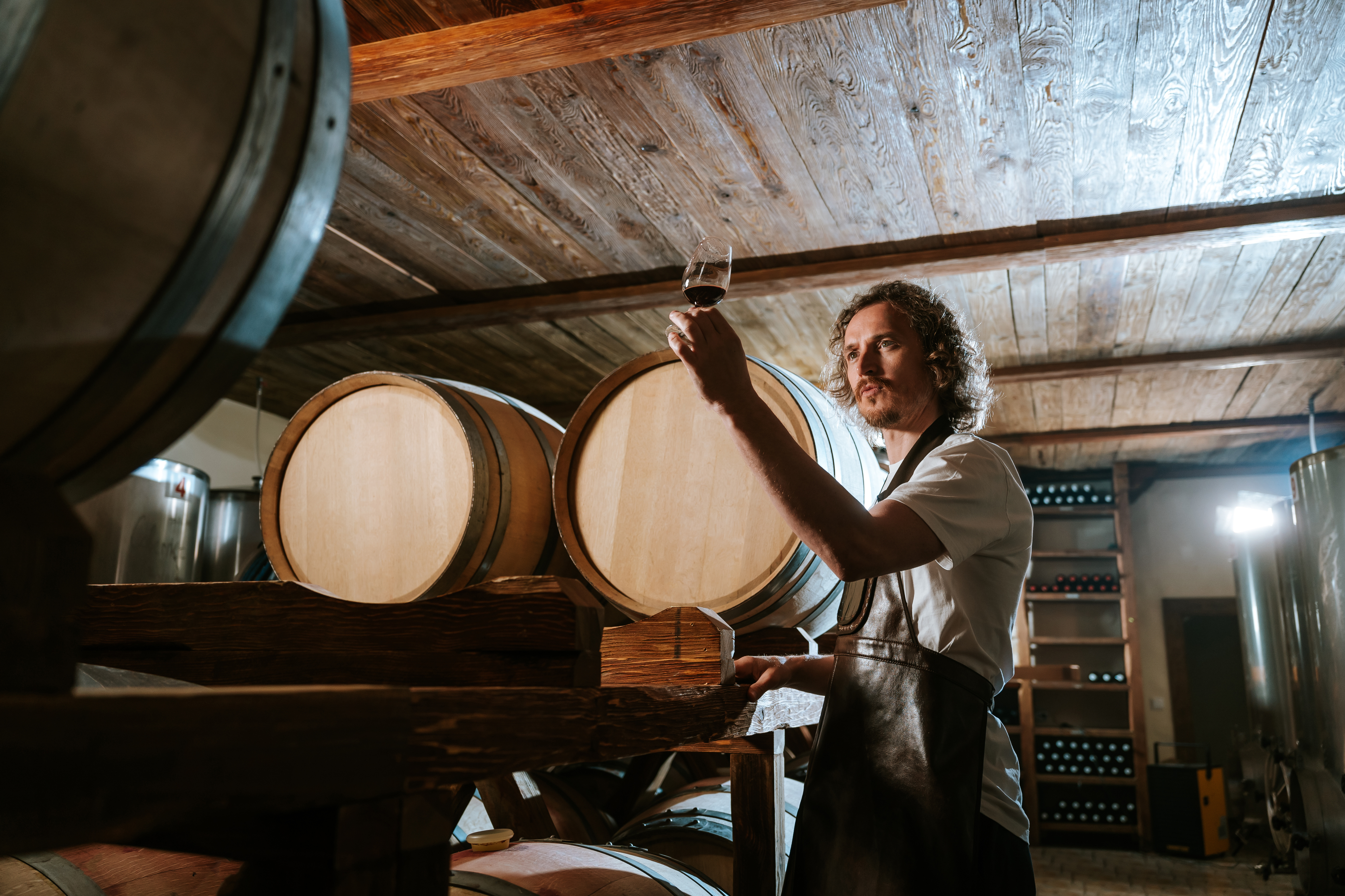 Winemaker tasting from barrel